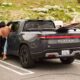 Rivian R1T charging at Tesla Supercharger