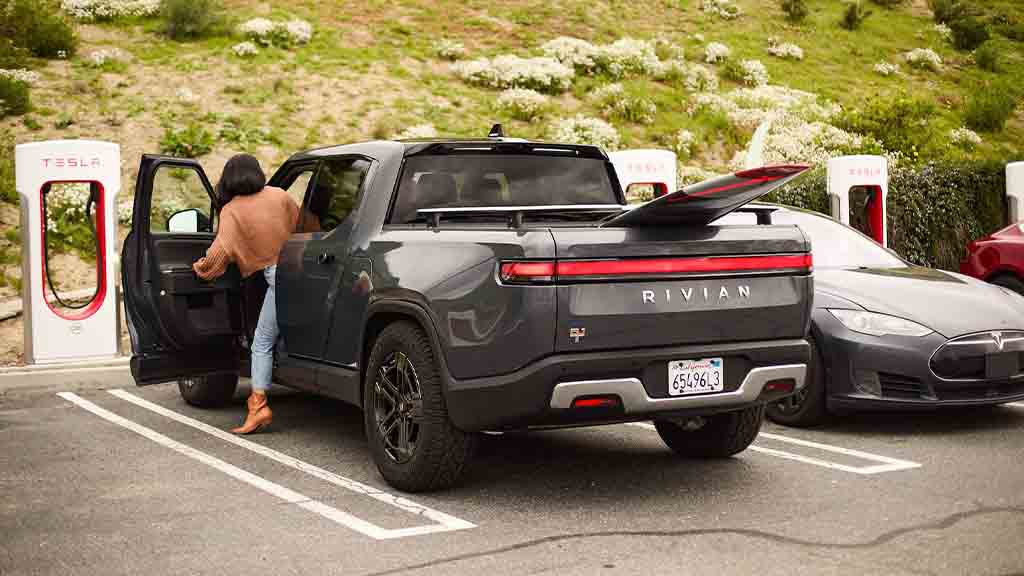 Rivian R1T charging at Tesla Supercharger