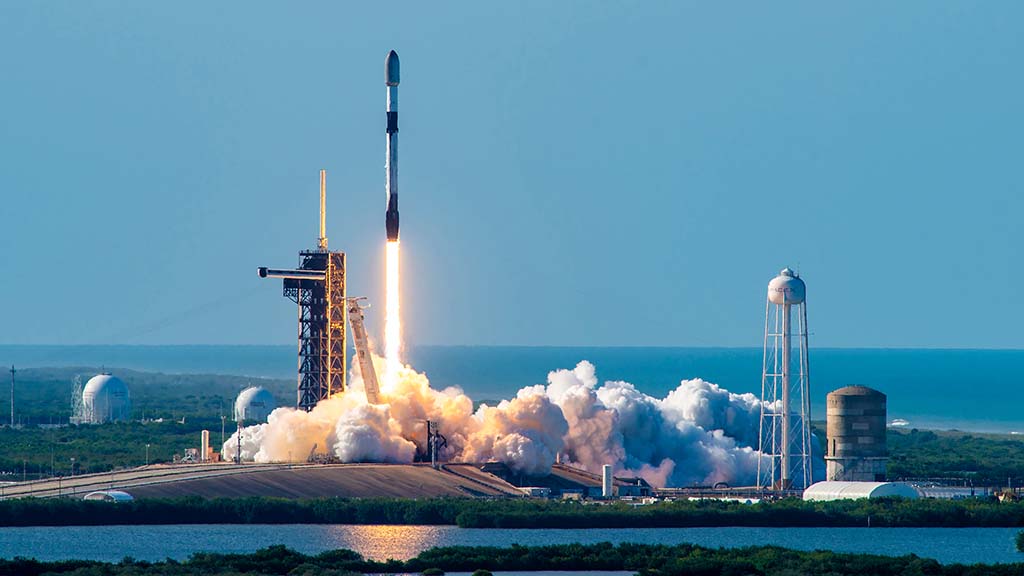 Space X Falcon 9 rocket lifting off from Launch Complex 39A (LC-39A) at NASA's Kennedy Space Center in Florida