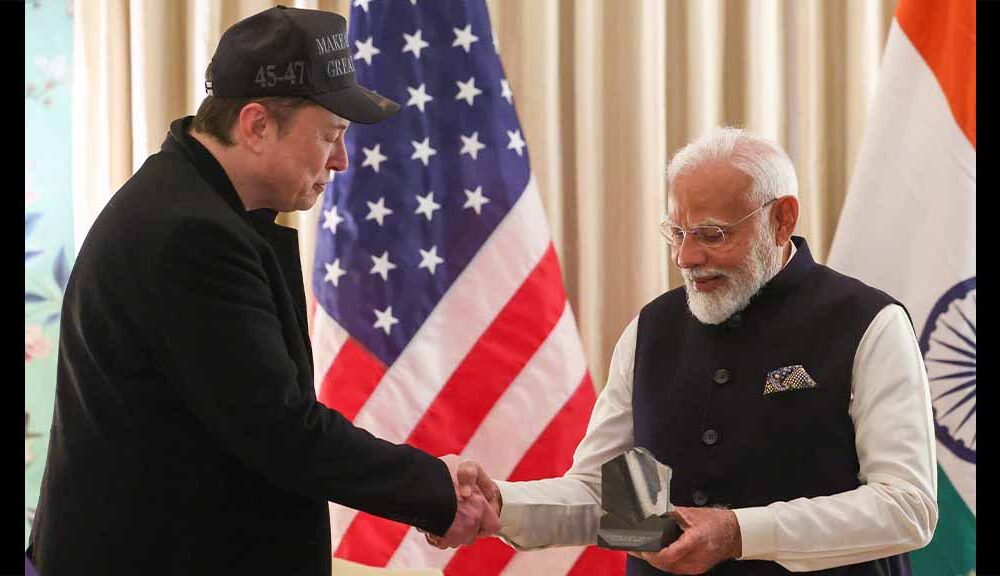 SpaceX Founder Elon Musk handing over a gift to Indian Prime Minister Narendra Modi