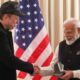 SpaceX Founder Elon Musk handing over a gift to Indian Prime Minister Narendra Modi