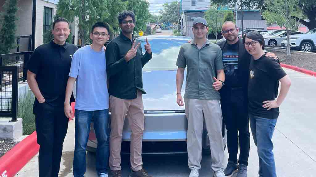 Tesla Officials with first fully autonomous Model Y delivery vehicle